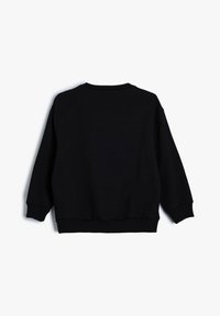 Zwart sweatshirt met een ronde halslijn en geribde manchetten. Zacht katoen met een ontspannen fit en een eenvoudige uitstraling. Geen grafische versieringen.