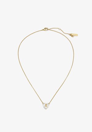 Collana d'oro con ciondolo a forma di cuore in cristallo, pietra centrale trasparente e catena delicata con chiusura a moschettone e dettaglio targhetta.