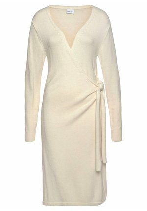 Vestido cruzado de punto en color crema con manga larga, escote en V y detalle de lazo lateral, longitud midi y puños acanalados.