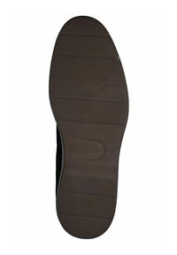 Scarpa nera con suola in gomma testurizzata, caratterizzata da scanalature per una migliore aderenza e un logo impresso. Design pulito e minimalista con forma arrotondata.