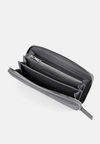 Gray leather wallet with a zip-around closure, multiple card slots, and compartments for coins and bills. Smooth texture and minimalist design.