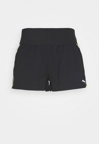 Black athletic shorts featuring a wide waistband and contrasting green accents at the pockets, made from a lightweight, flexible fabric.