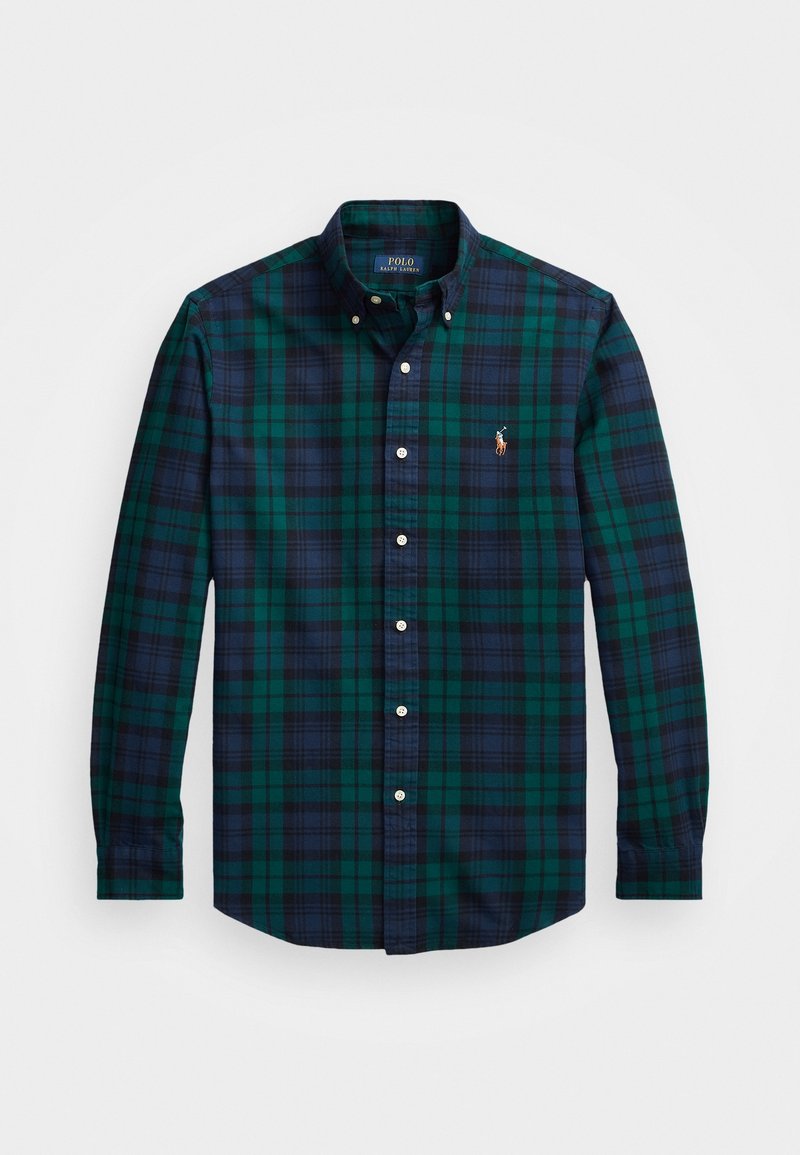 Koszula w kratę zapinana na guziki, w kolorach zielonym i granatowym, z delikatną teksturą. Posiada kołnierz, długie rękawy oraz haftowane logo na klatce piersiowej.