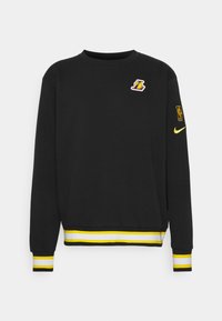 Svart sweatshirt med långa ärmar, rund hals, gult och vitt randigt på ärmsluten och fållen, med en Lakers-logotyp på bröstet och NBA-logotyp på ärmen.