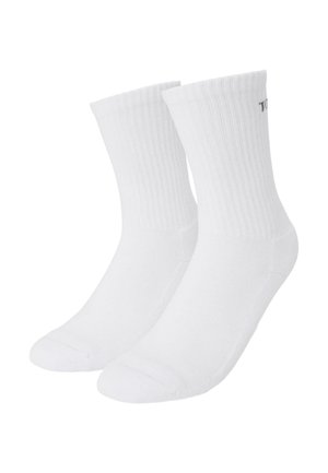 Calze a crew in cotone bianco a coste con punta e tallone rinforzati, dotate di una minimalistica etichetta laterale, che offrono una vestibilità classica e aderente.
