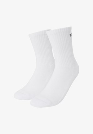 Șosete din bumbac alb cu banda ribbed, cu vârf și călcâi întărit, având un branding minim pe lateral, oferind o potrivire clasică și confortabilă.