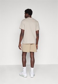Nike Performance UNLIMITED - Spordišortsid - khaki/black