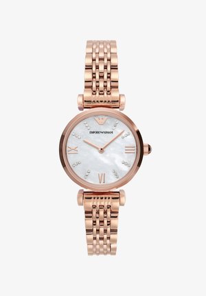 Roségoldene Uhr mit einem runden Gehäuse, Zifferblatt aus Perlmutt, römischen Ziffern und Kristallakzenten. Verfügt über ein verknüpftes Metallarmband.