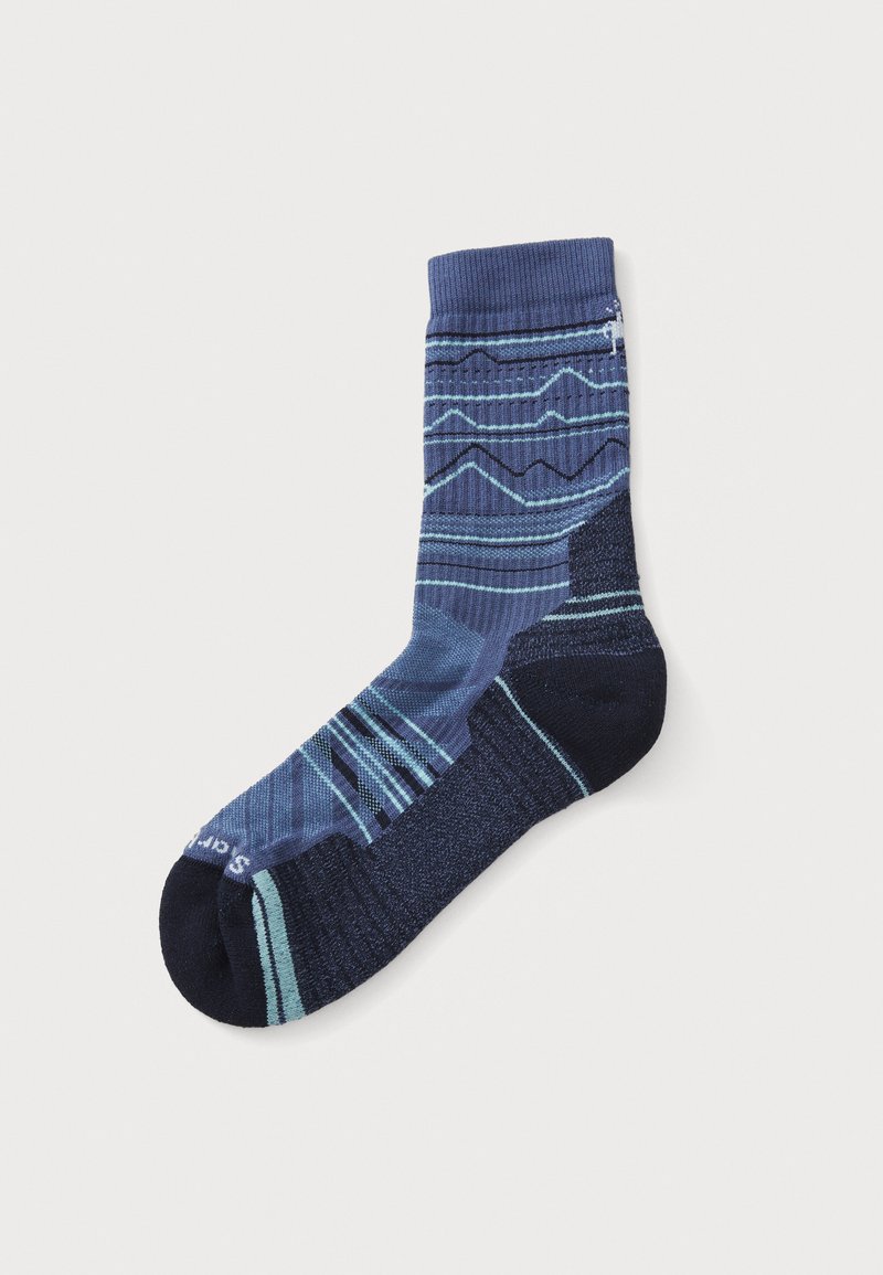 Mörkblå strumpor med blå geometriska mönster, med ribbad mudd och olika texturerade band längs skaftet och foten för ökad komfort.