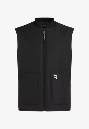 Must musta ilmaiktega vest, millel on eest lukuga kinni minevus, kaks eesmist taskut ja väike logopatch. Valmistatud siledast, vastupidavast kangast kaasaegse disainiga.