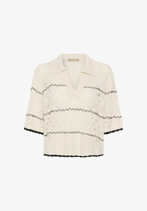 Pulover scurt cu mâneci scurte, tricot crem, cu guler, decolteu în V, modele din dantelă, dungi negre în zigzag și tiv negru cu margini ondulate la mâneci și tiv.