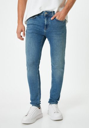 JUSTIN - Vaqueros pitillo - blue denim