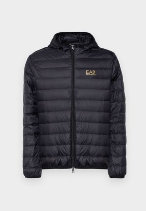 Black puffer jacket with a hood, featuring a zip front and vertical quilted design. Gold EA7 logo on the left chest. Smooth texture.