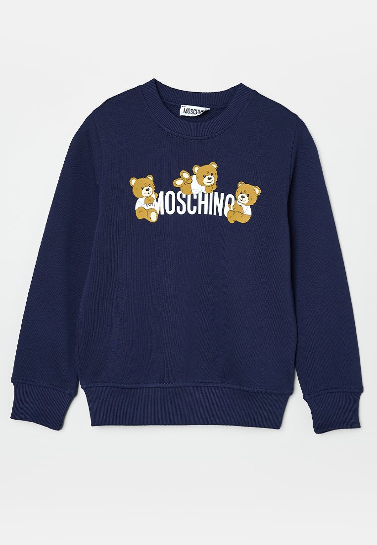 Sweatshirt bleu marine avec texture côtelée, arborant trois ours en dessin animé et "Moschino" en lettres blanches sur le devant.
