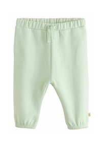 Pantaloni della tuta in cotone verde chiaro con vita elasticizzata e polsini alla caviglia. Presenta un cordino e un piccolo etichetta logo sul lato.