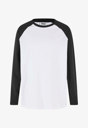 Tricou cu mânecă lungă, având un corp alb și mâneci negre raglan, decolteu rotund și material moale din bumbac.