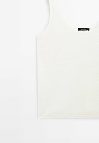 White cotton tank top with a scoop neckline and regular fit. Smooth texture, no visible patterns or accents, clean-cut hem.