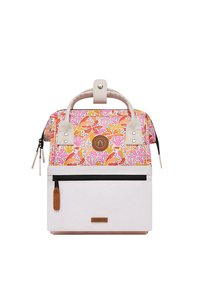Multicolored floral backpack with a white base, top handle, zipper compartments, and brown branding patch. Decorative patterns on fabric.