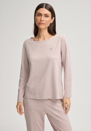 Ensemble de vêtements de détente rose clair comprenant un haut à manches longues avec un col rond et un motif géométrique, associé à un pantalon à motifs assortis.