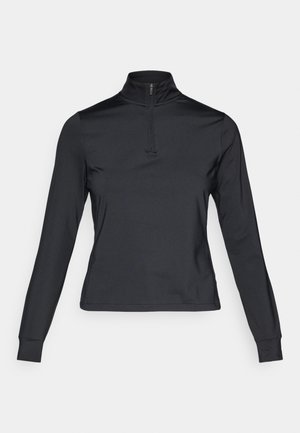 Zwarte langemouwen pullover met een hoge ritskraag, gemaakt van soepel materiaal. Heeft aansluitende mouwen en een cropped ontwerp.
