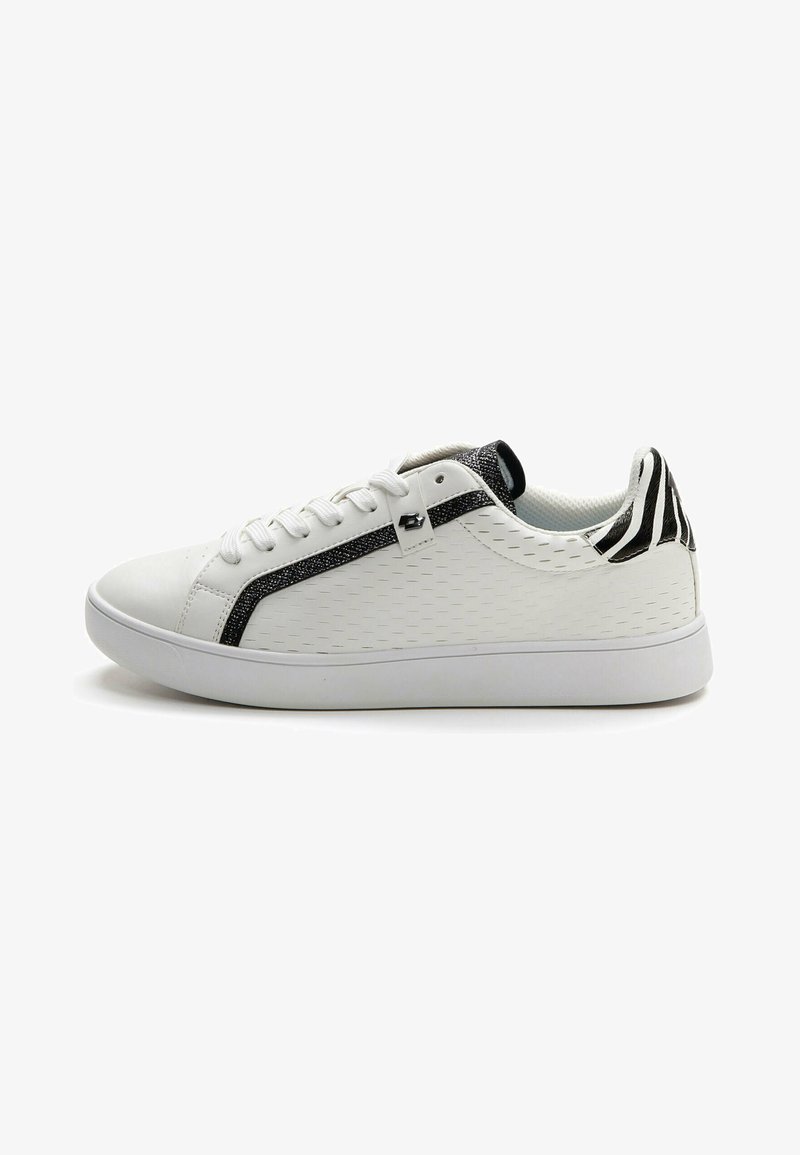 White sneaker with textured synthetic upper, black sparkly accent stripe, and a patterned black and white heel. Features traditional lacing.