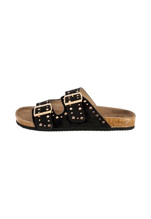 Sandale slide noire avec deux brides réglables à boucle, clous dorés, semelle intérieure en liège et semelle extérieure en caoutchouc texturé.