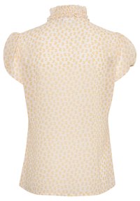 Blouse à manches courtes avec volants en tissu jaune clair, présentant un motif en forme de cœur, une texture lisse et une coupe décontractée.