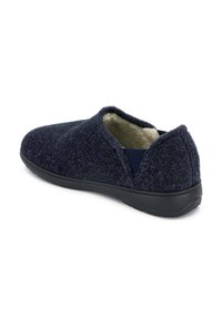 Pantofole blu scuro con una parte superiore in pile testurizzato, lato elastico per una facile calzata e suola in gomma nera per una buona aderenza. Fodera interna morbida.