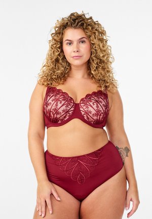 Burgundy lingerie set featuring a sheer lace bra with scalloped edges and floral embroidery, paired with high-waisted briefs with a similar design.