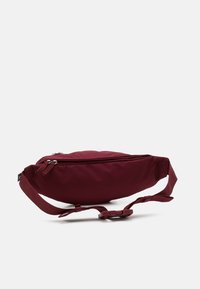 Nike Sportswear HERITAGE WAISTPACK UNISEX - Bolsa de cintura - dark beetroot/dark beetroot/pink oxford