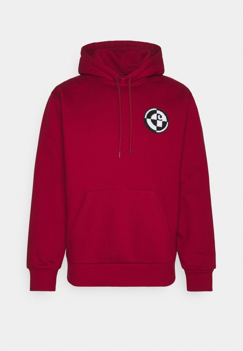Red hooded sweatshirt made of soft fabric, featuring a front pocket, drawstrings, and a circular embroidered logo on the chest.