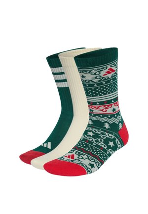 Drei Paar Sneakersocken in Grün, Creme und Grün mit weißen und roten festlichen Mustern und roten Zehen.