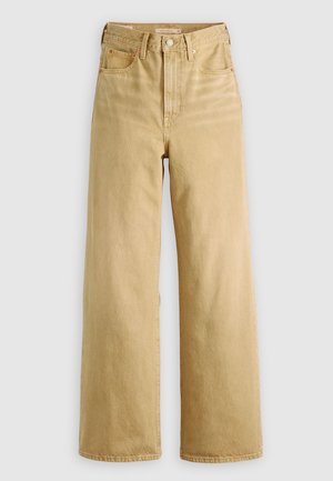 Lys beige høytlivsjeans i denim, med vide ben, sidelommer og subtile sømdetaljer. Glatt tekstur med en ikke-slitt finish.
