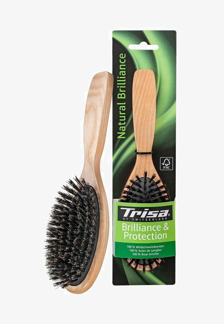 Holzbürste mit natürlicher Oberfläche, ausgestattet mit schwarzen Wildschweinborsten, ovaler Form, ergonomischem Griff und verpackt mit grün-schwarzem Branding.