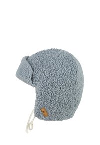 Blue fleece hat with ear flaps, textured fabric, adjustable chin strap, and a small brown leather tag on the side.
