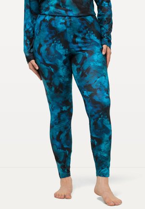 Blauwe en zwarte geprinte legging gemaakt van rekbaar materiaal, met een abstract ontwerp en een slanke pasvorm. Geen zichtbare sluitingen.