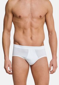 Witte boxershorts met een aansluitend ontwerp, gemaakt van een gladde stof met subtiele streepjes. Elastische tailleband aan de bovenkant.