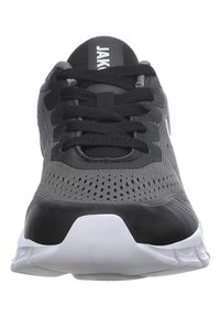 Black and gray athletic shoe with a breathable mesh upper, padded tongue, and rubber sole. Features black laces and perforated details.
