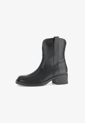 Black leather ankle boot with a low block heel and pull tab, sleek design, and stitched detailing along the sides.