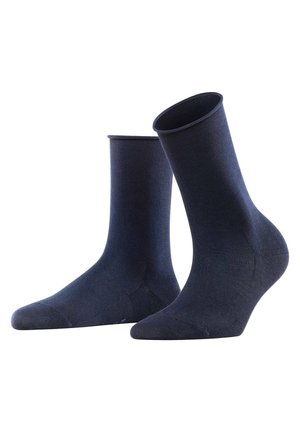 Calze in cotone blu navy con texture liscia, altezza a metà polpaccio e tallone e punta rinforzati. Design semplice, senza fantasie o decorazioni.
