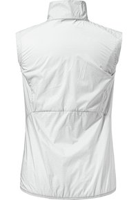 Gilet léger sans manches en blanc, avec un col montant, une texture lisse et des détails froncés sur les côtés pour un look ajusté.