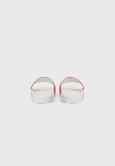 Pink and white slide sandals with an open back, featuring a smooth rubber material and a wide band design. Minimalist style with a flat sole.