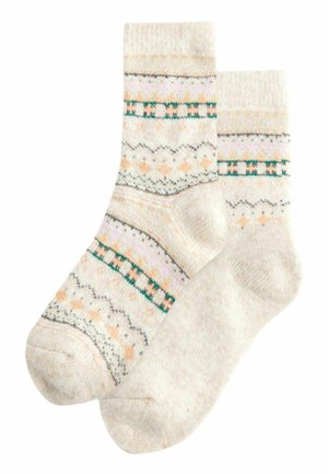Chaussettes en tricot de couleur beige clair avec un motif texturé. Présentent des rayures vertes et roses, des diamants orange et des accents festonnés.