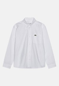 Camicia bianca a maniche lunghe realizzata in cotone, con colletto a pulsante e taschino sul petto con un piccolo logo verde a sinistra.