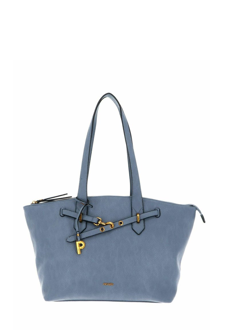 Sac fourre-tout en cuir bleu avec deux poignées, featuring accents en quincaillerie dorée et une sangle décorative. Texture lisse et design minimaliste.