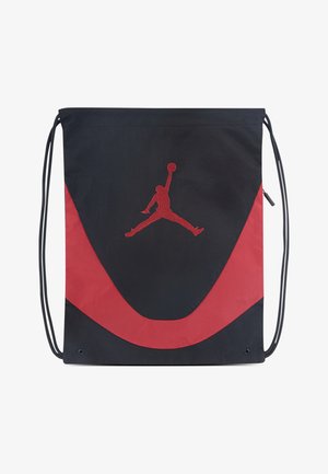Sacca con coulisse nera con accenti rossi, caratterizzata da tessuto liscio, ampio logo Jumpman rosso e occhielli rinforzati per la durata.