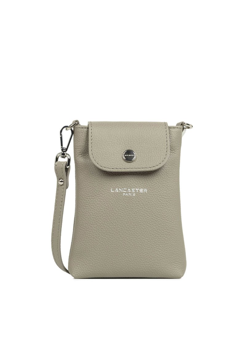 Gray leather crossbody bag with a flap closure, silver hardware, printed logo, and an adjustable strap. Textured surface with minimalistic design.