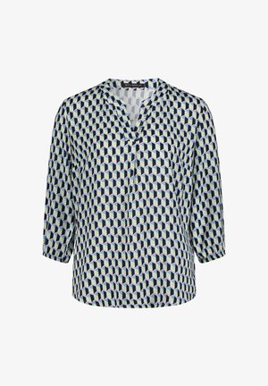 Bluzka z nadrukiem, z dekoltem w serek i rękawami do łokcia. Posiada geometryczny wzór w granatowym, zielonym i jasnokremowym kolorze. Ma jedwabistą fakturę.