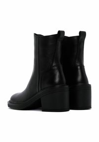 Black leather ankle boots with a rounded toe, elastic side panels, and a stacked block heel. Smooth texture and sleek design.