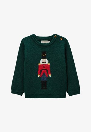 Pull en maille verte avec un motif de casse-noisette en rouge, noir, blanc et bleu, doté d'un col rond et d'une fermeture à deux boutons sur l'épaule.